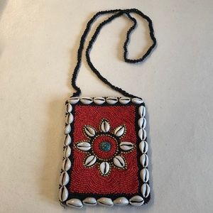 Peruvian Connection Beaded clutch with shells.